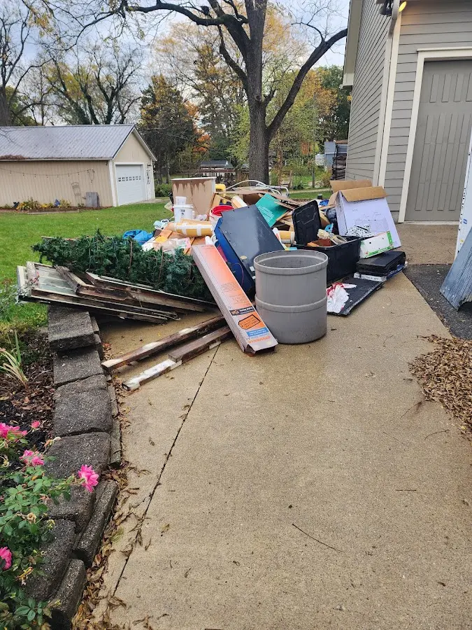 Dumpster being loaded with debris for 12 Yard Dumpster Rental in Newburgh